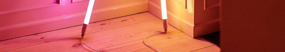 Two Hay Neon tube lighting stand on wooden floor